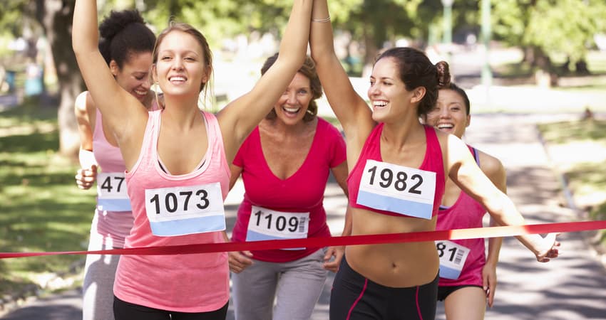 group of women finishing a marathon together