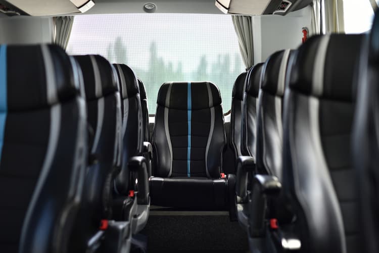 Black, plush seats inside minibus