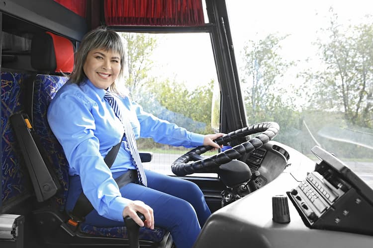 Woman driving bus