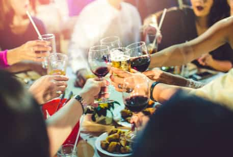 Close up of people toasting wine