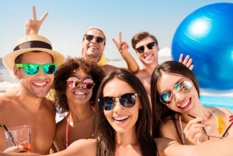 Group laughing and smiling in the pool