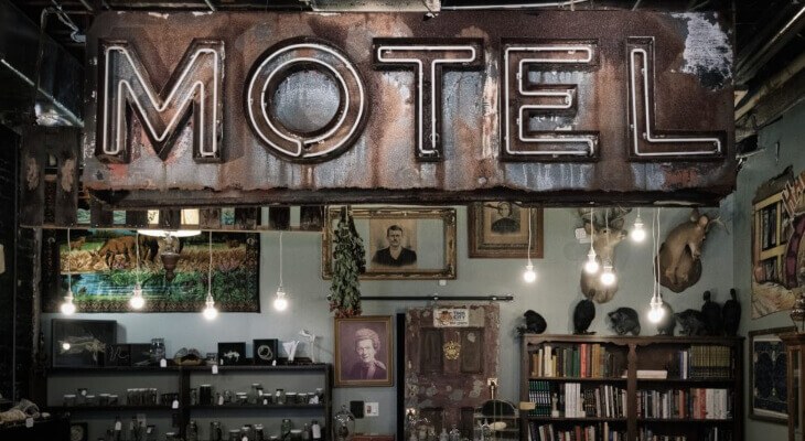 An old motel sign inside of the Dysfunctional Grace Art Company store.